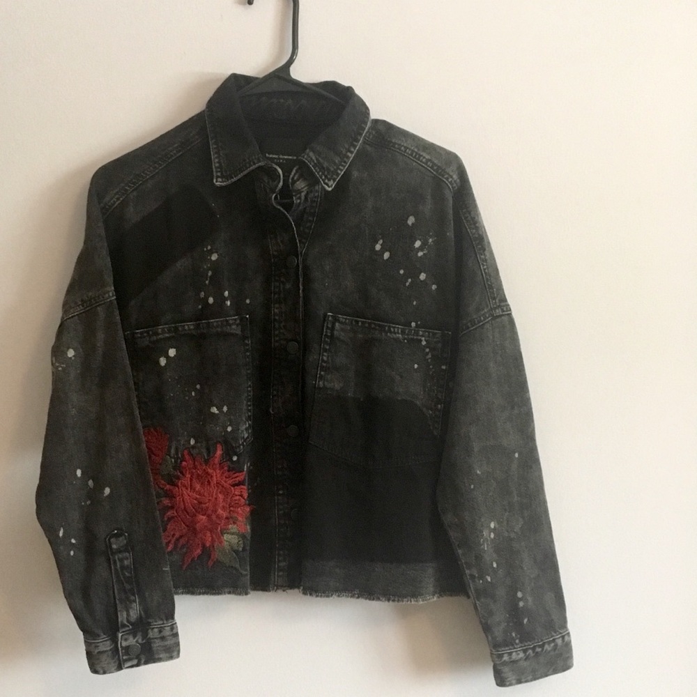 Black denim jacket with red embroidery detail
